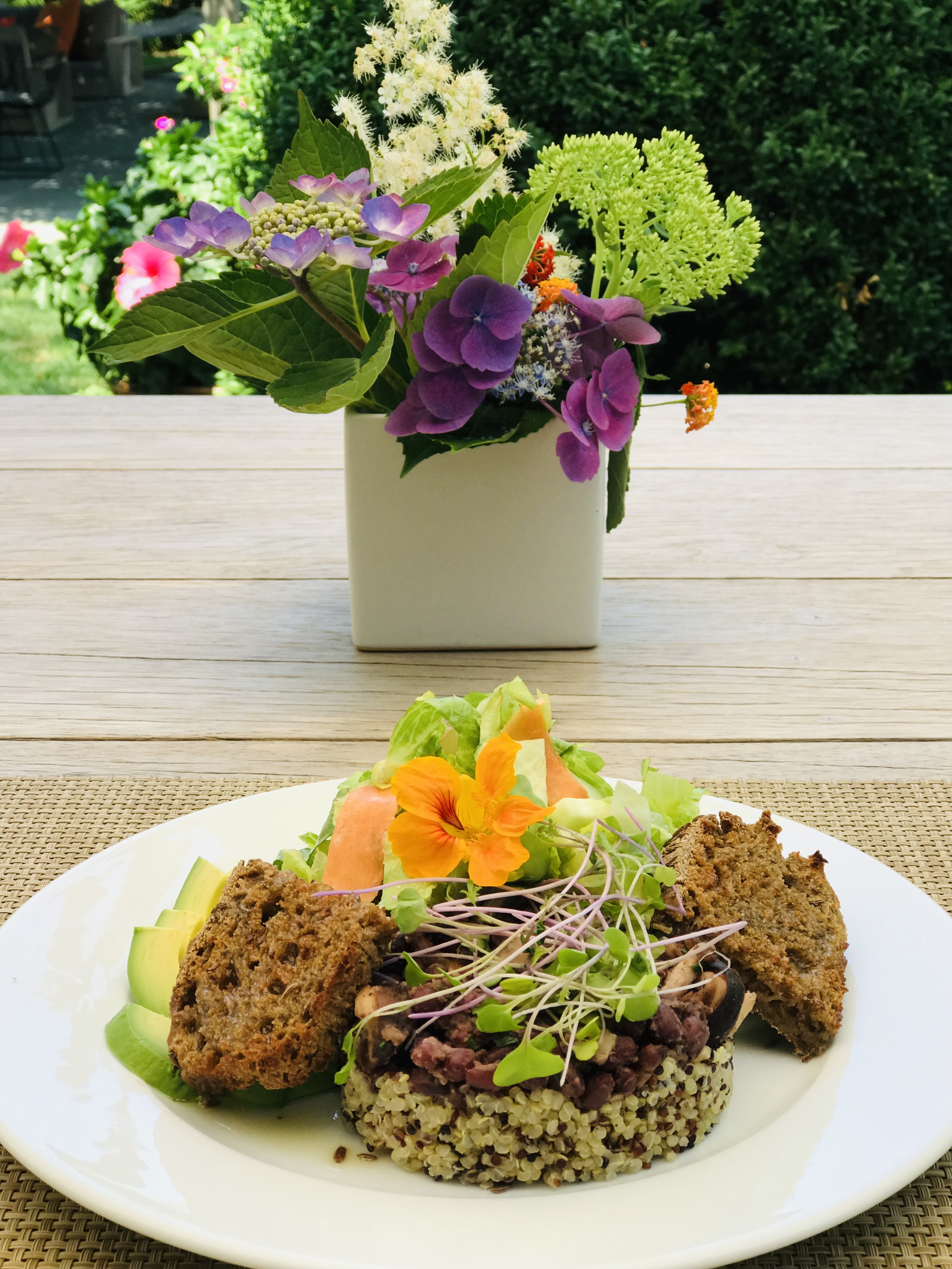 Quinoa bowl with edible flowers